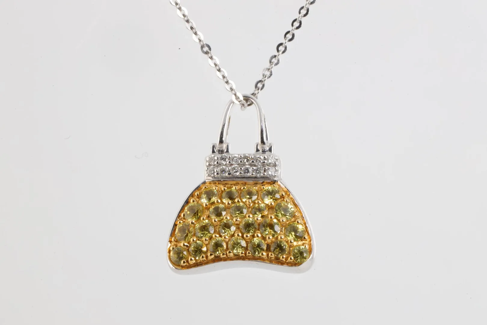 18"18k White Gold 0.12tcw Diamond 1.45tcw Yellow Sapphire Purse Necklace(4.94g.)